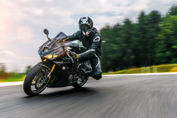 motorbike on the road driving fast. having fun on the empty highway on a motorcycle  journey. copyspace for your individual text.